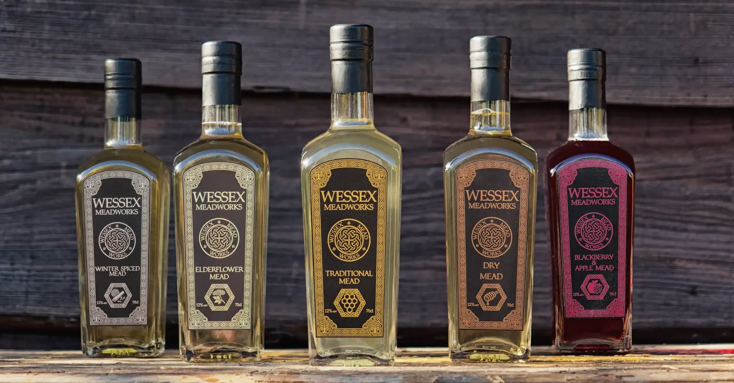 Wessex Meadworks large bottles, wood backdround and table